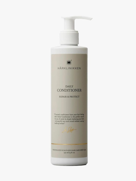 Harklinikken Daily Conditioner white pump bottle on light gray background