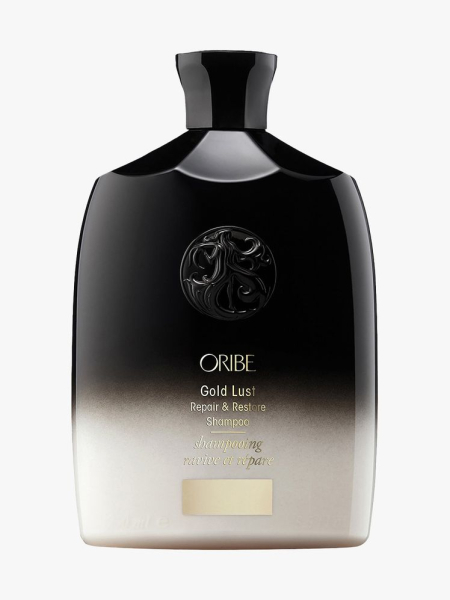 Gold Lust Repair & Restore Shampoo black to white gradient bottle of shampoo on light gray background